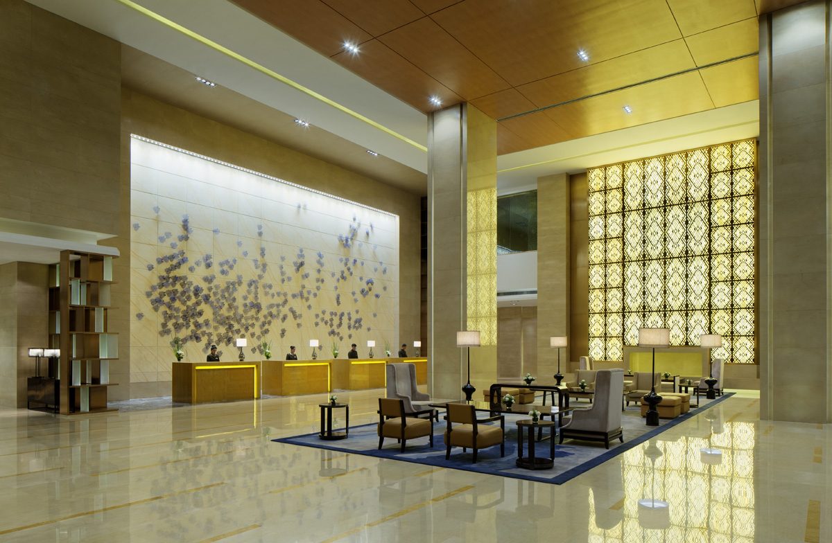 Grand hotel lobby and reception hall photographed in warm ambient light
