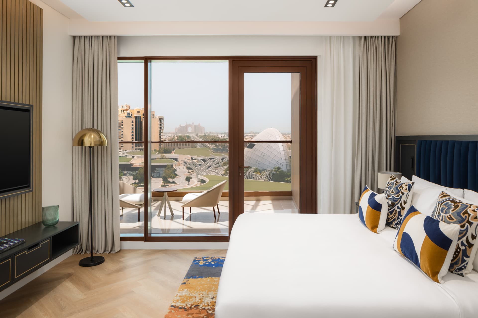 Cheval Maison The Palm master bedroom after the photography refresh — warm balanced light with Atlantis and Palm Jumeirah views
