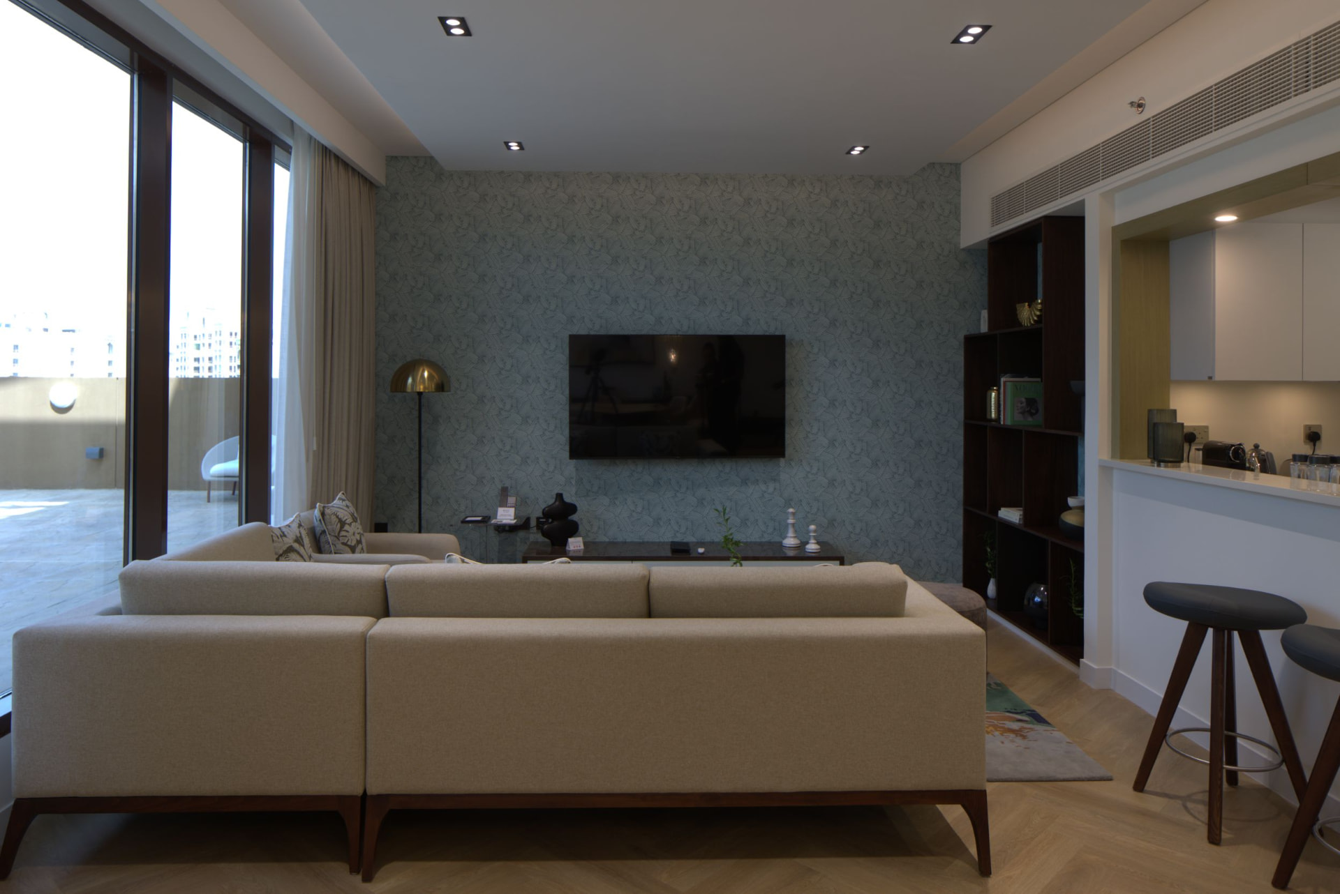 Cheval Maison The Palm living room before the photography refresh — flat lighting and rear-facing composition