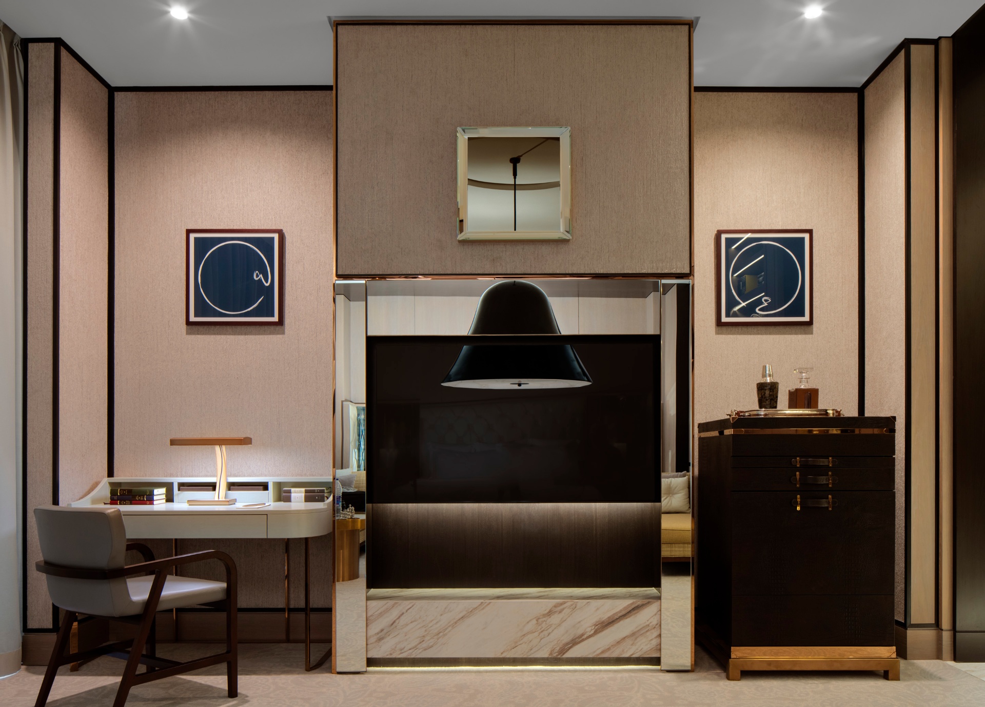 Suite study at The St. Regis with writing desk, leather chair and daylight from a tall window