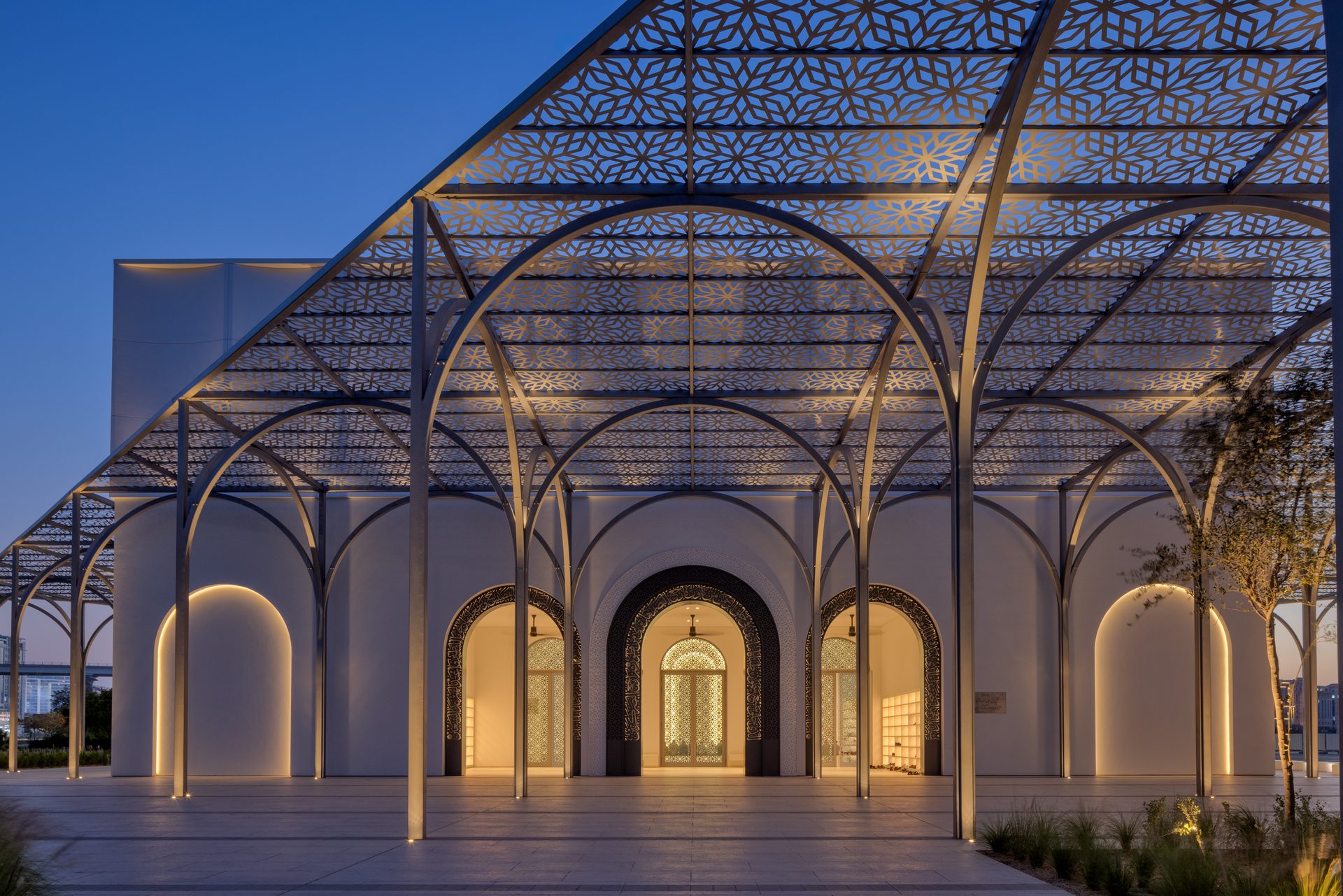 Illuminated tower and pavilion architecture photographed at blue hour in the UAE