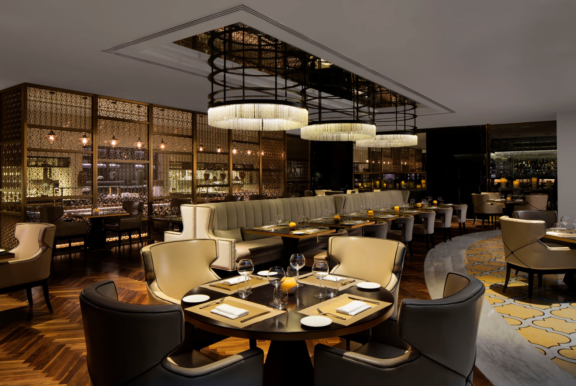 Luxury hotel suite in the UAE with layered textiles and natural window light