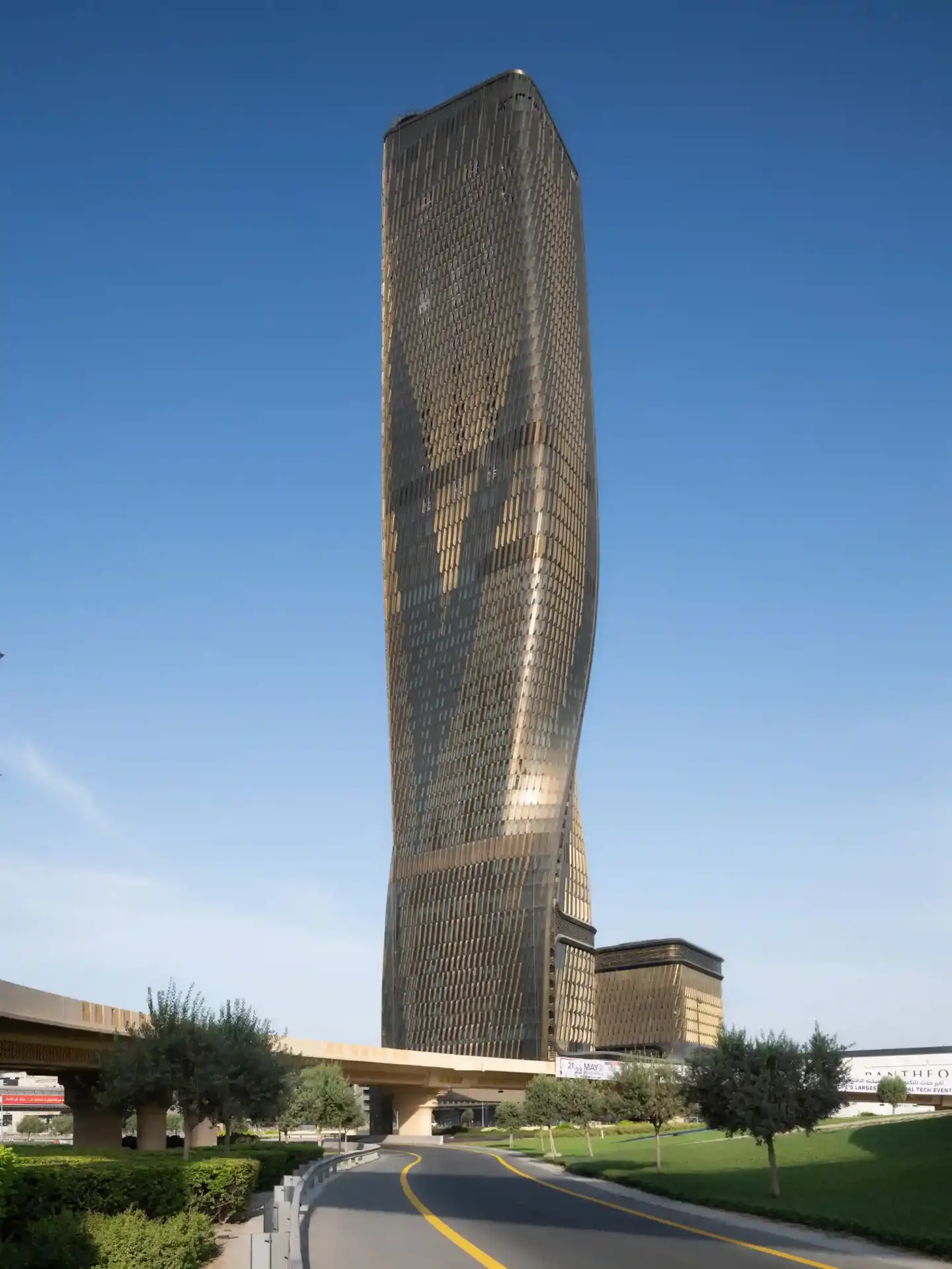 Twisted residential tower in Dubai Marina photographed in warm evening light